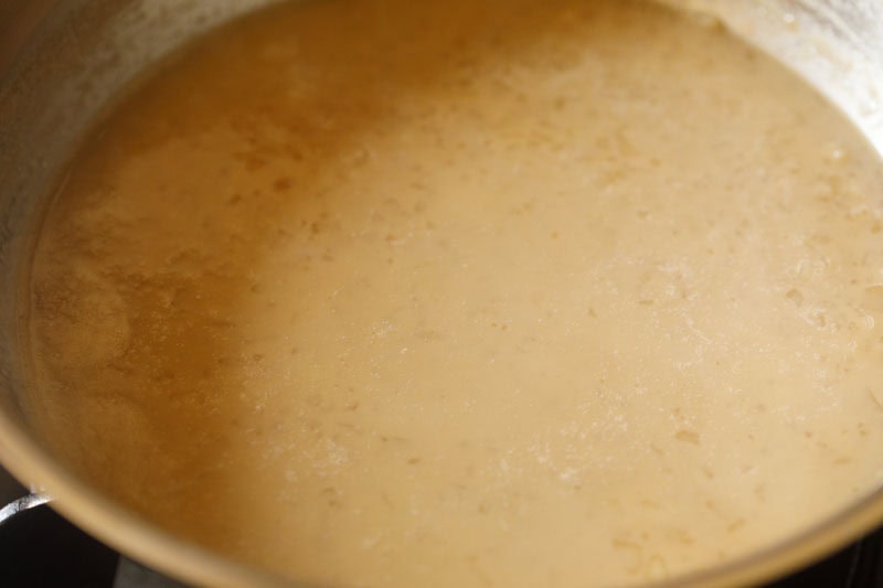 Ada pradhaman being cooked in pan.