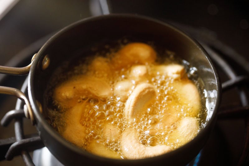 Cashews being fried.