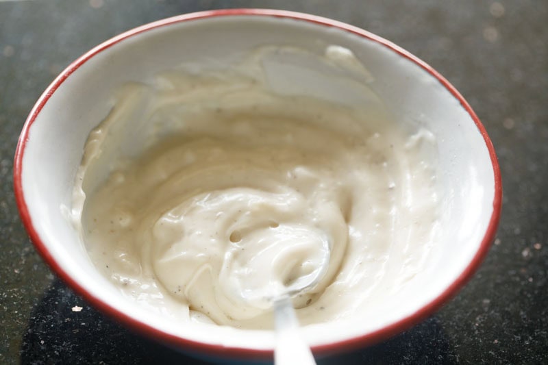Prepared garlic aioli sauce in bowl.