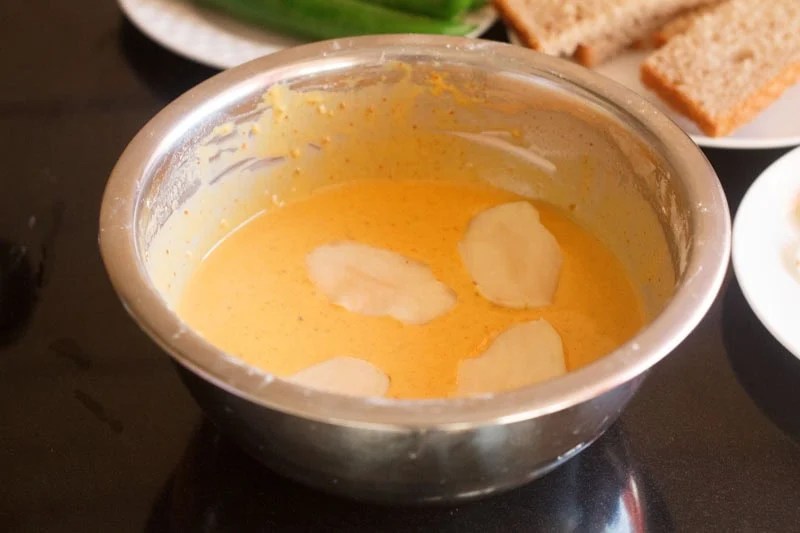 Sliced potatoes dipped in seasoned and spiced gram flour batter.