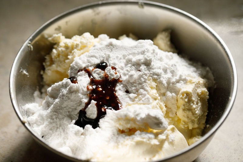 Cream cheese, powdered sugar and vanilla extract in a mixing bowl.