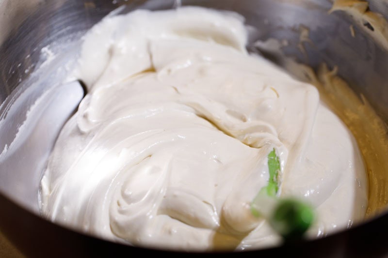 Whipped cream folded with whipped cream cheese to form cheesecake filling.