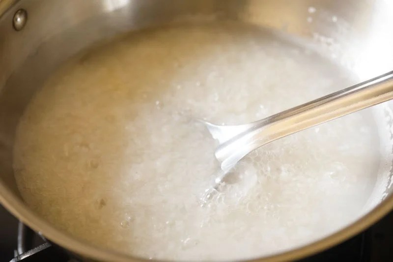 Cooking ada in a pot.