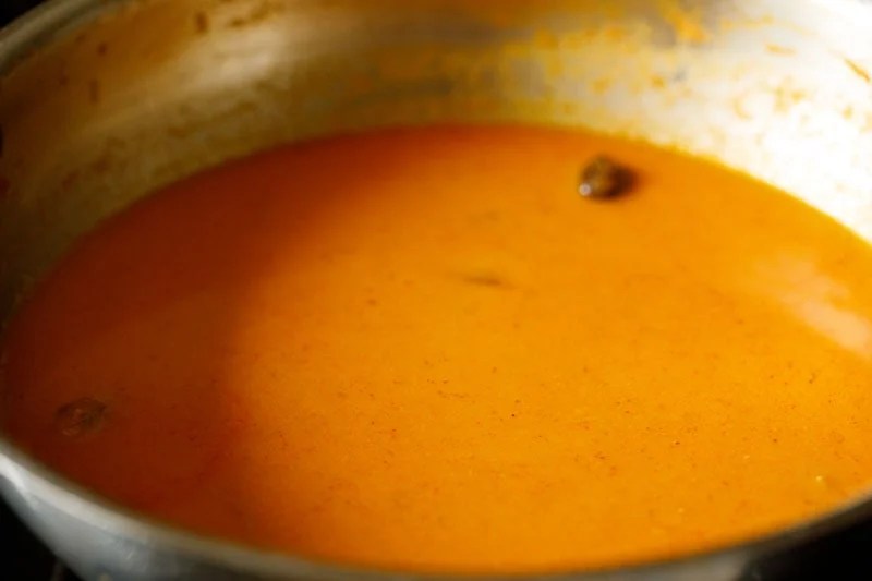 water mixed with the sautéed masala to form malai kofta gravy