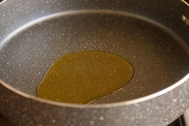 Melted ghee in a thick bottomed pan.