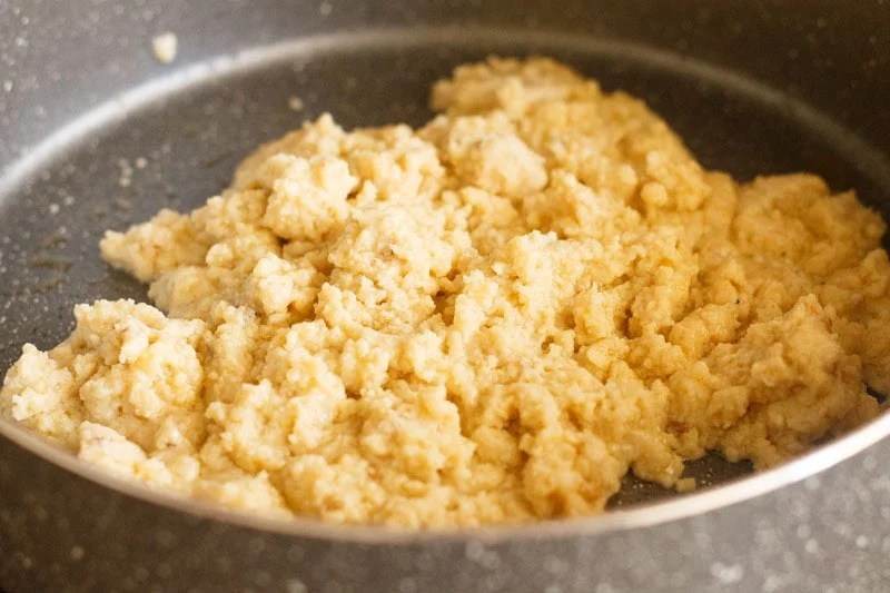 Mawa being cooked in pan.