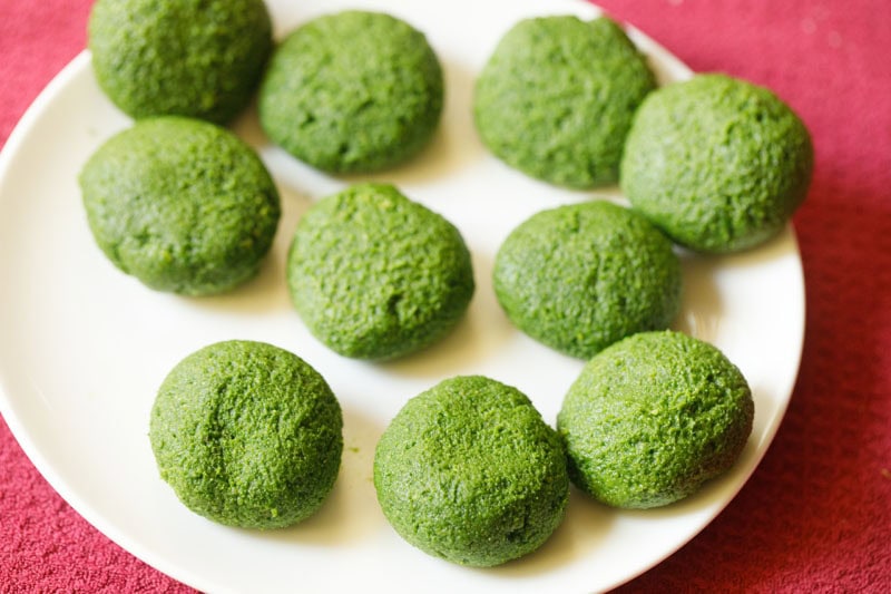 Flattened spinach mixture rounds.