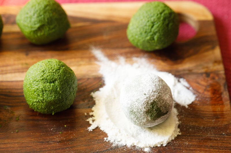 Palak kofta ball coated with rice flour.