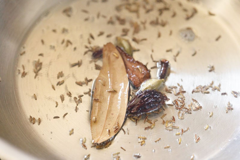 Whole spices and tej patta in oil.