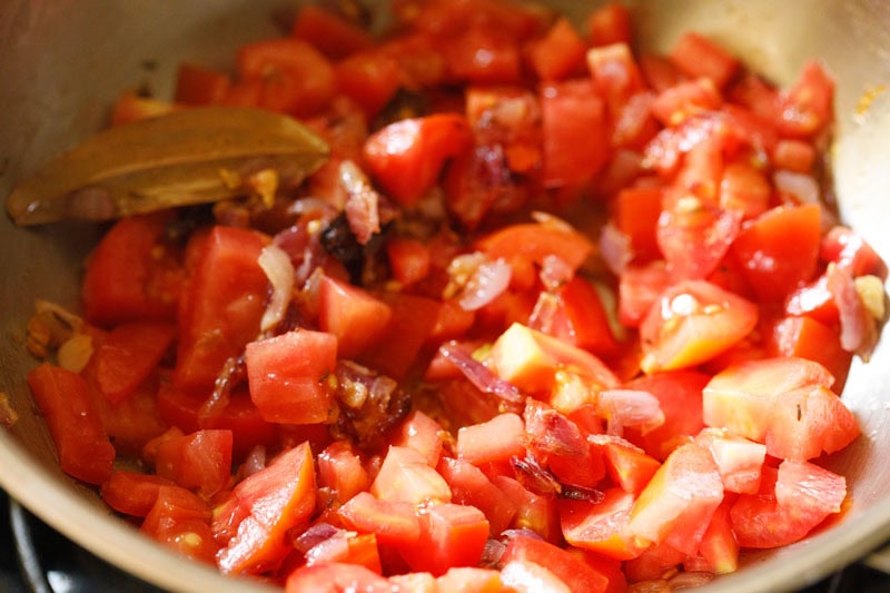 Tomatoes added to pan.