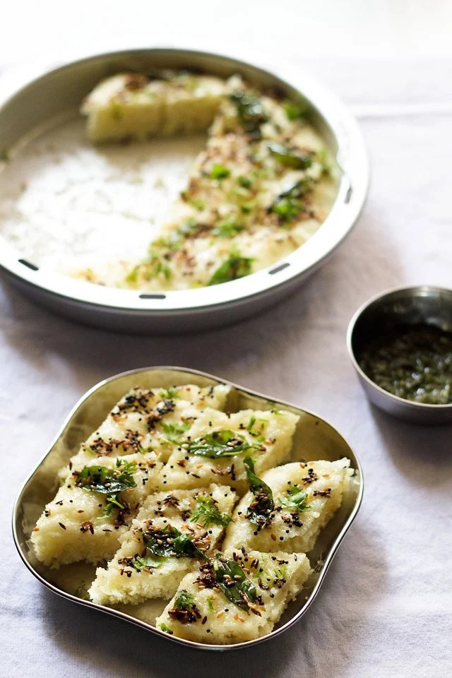 rava dhokla served in a steel plate